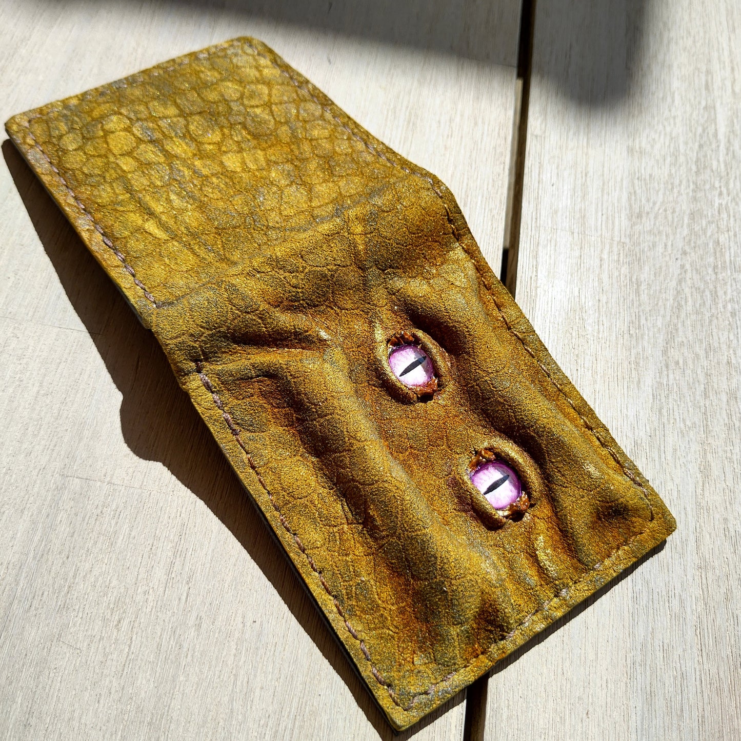 Enderman eyes - Golden Shmuggle face - Necromonicon - Pink demon eyes - Leather wallet.
