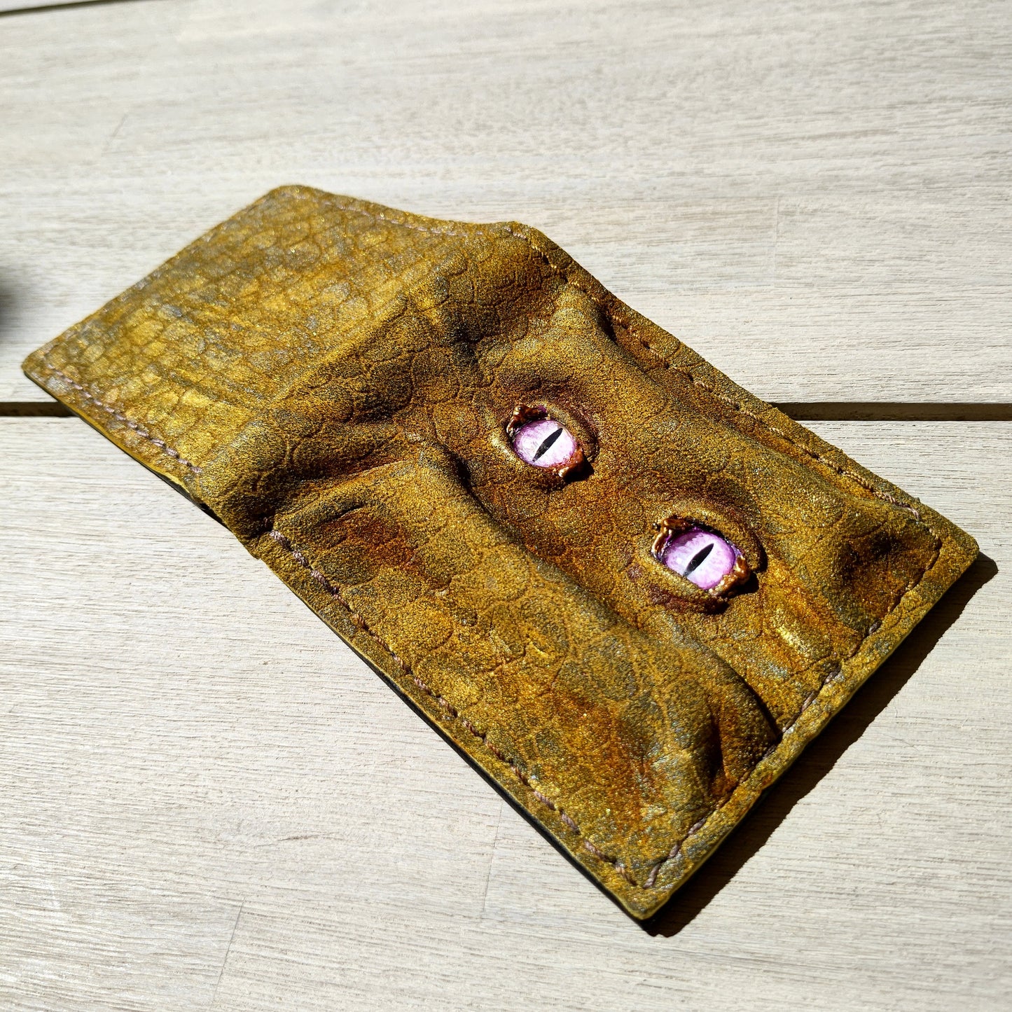 Enderman eyes - Golden Shmuggle face - Necromonicon - Pink demon eyes - Leather wallet.