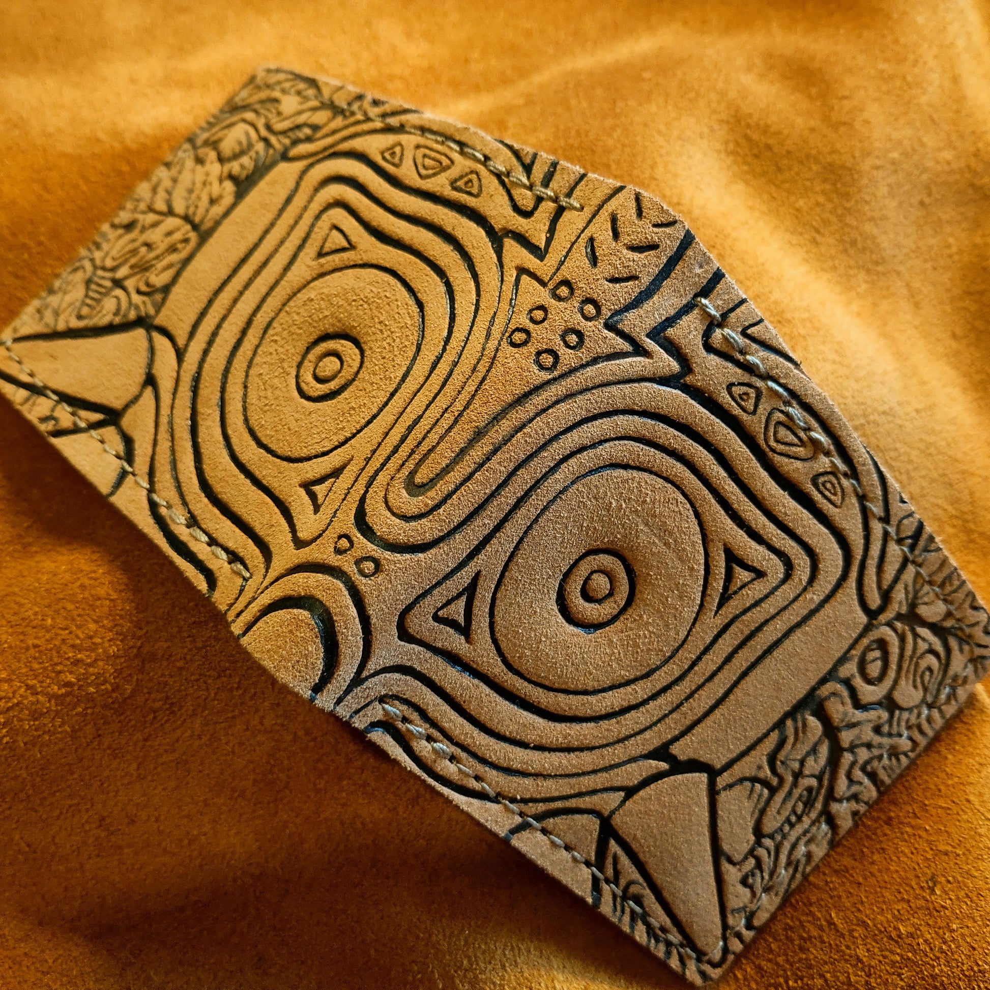 Suede Majoras Mask Leather wallet.
