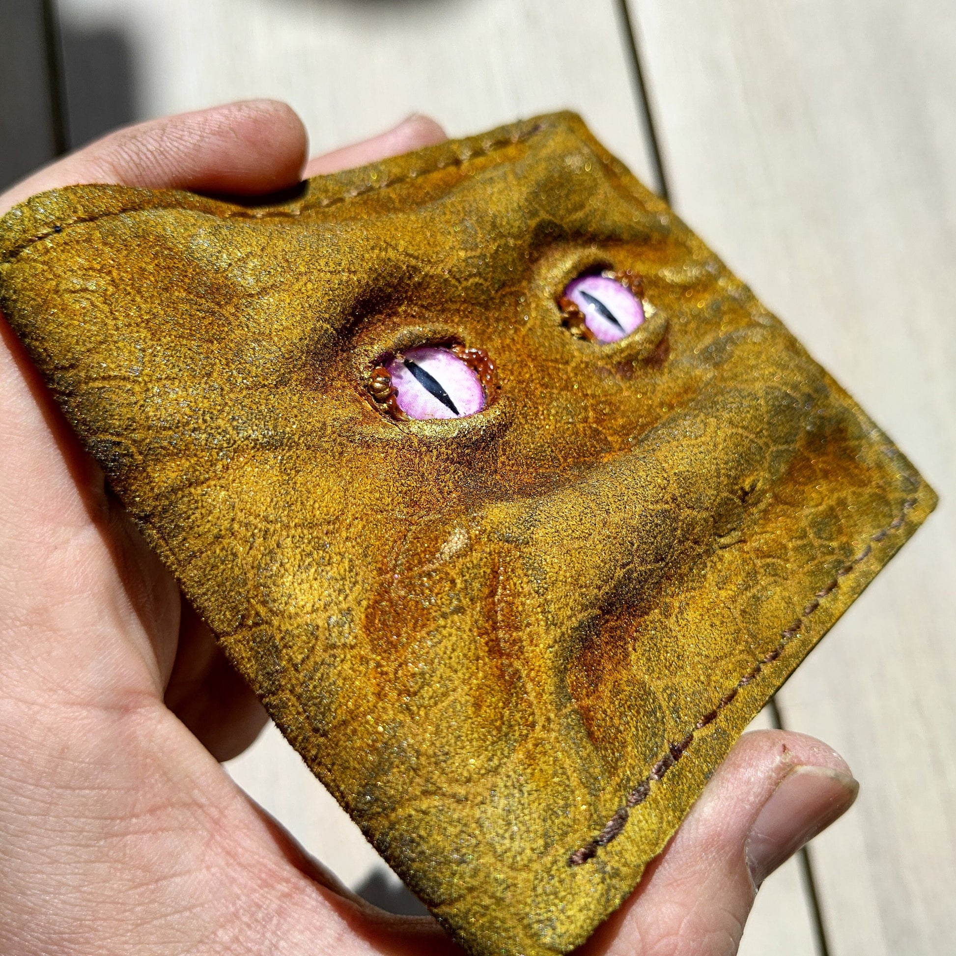 Enderman eyes - Golden Shmuggle face - Necromonicon - Pink demon eyes - Leather wallet.