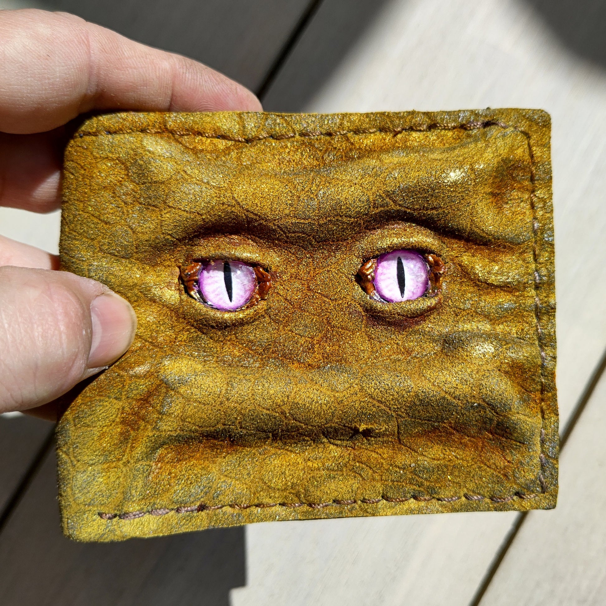 Enderman eyes - Golden Shmuggle face - Necromonicon - Pink demon eyes - Leather wallet.