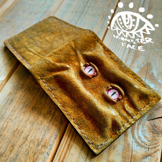 Enderman eyes - Golden Shmuggle face - Necromonicon - Pink demon eyes - Leather wallet.