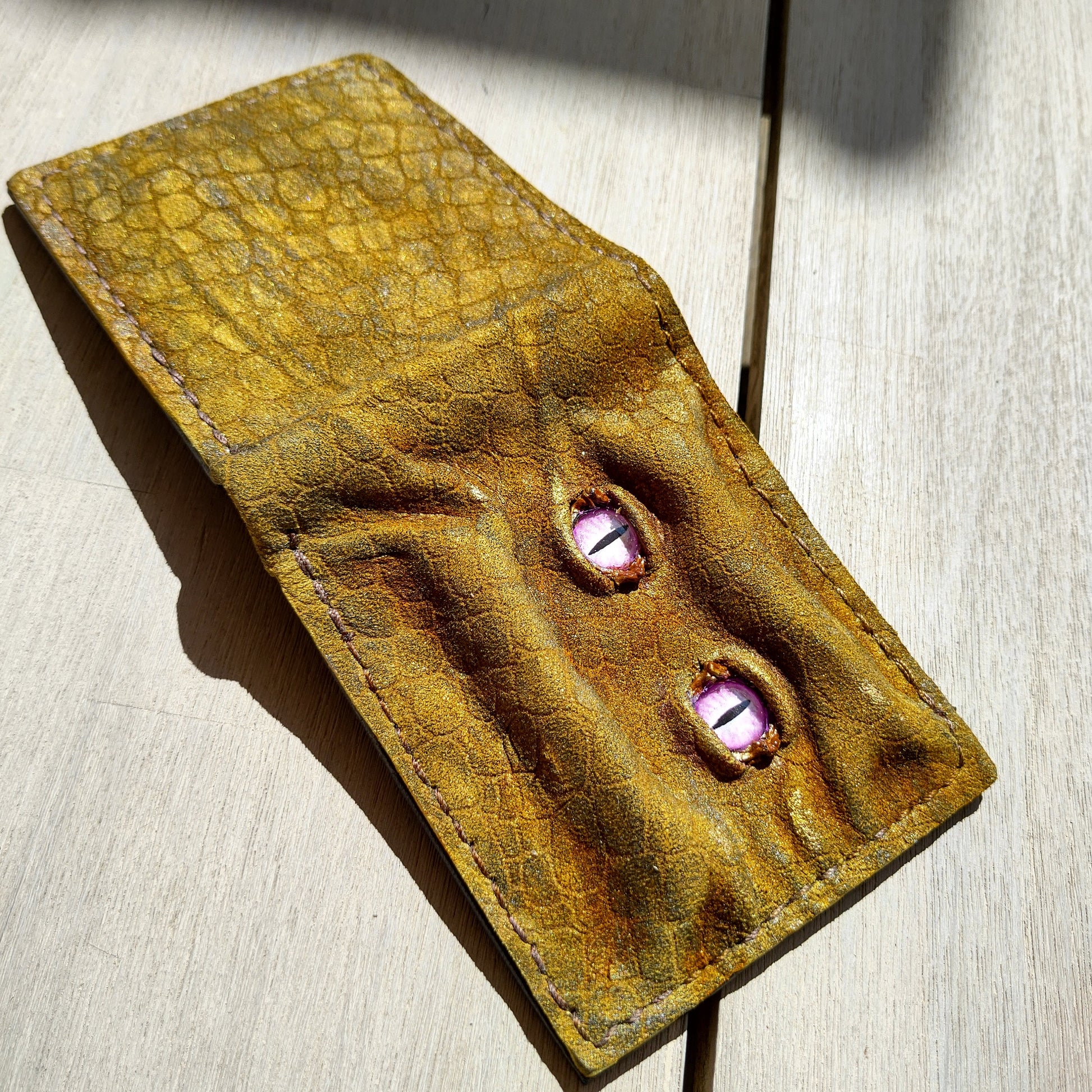 Enderman eyes - Golden Shmuggle face - Necromonicon - Pink demon eyes - Leather wallet.