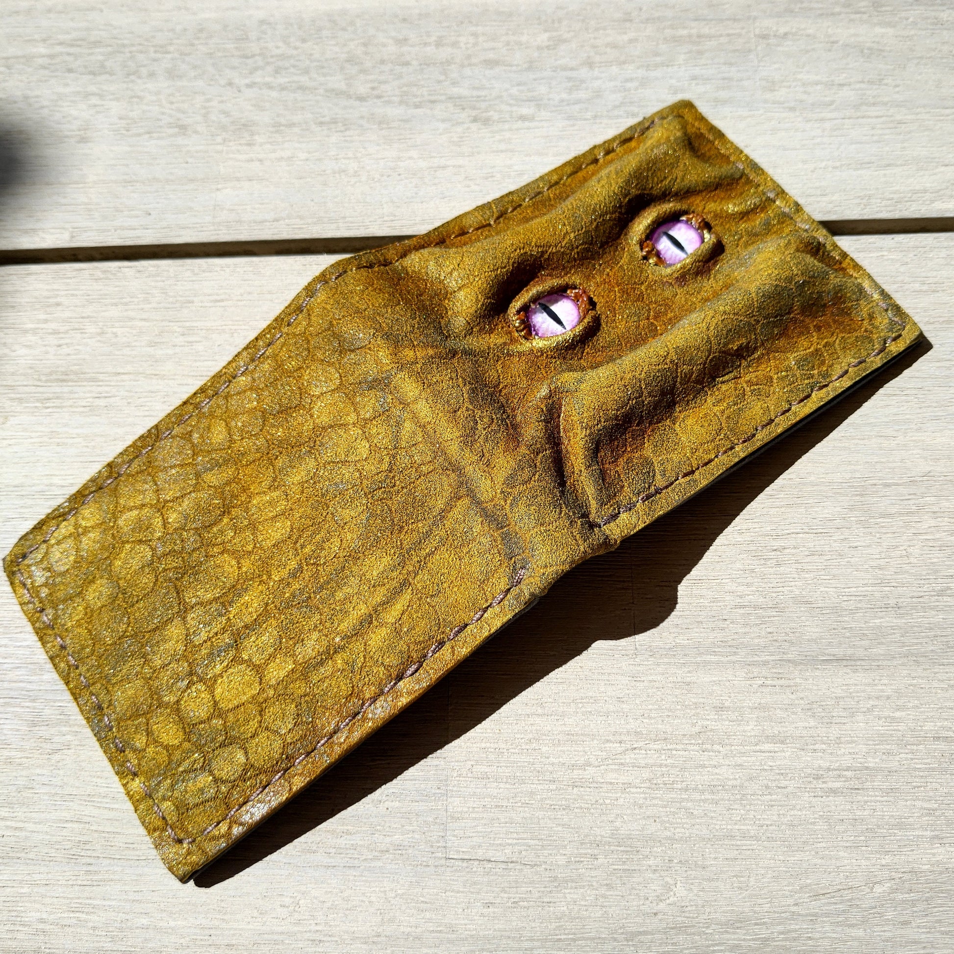Enderman eyes - Golden Shmuggle face - Necromonicon - Pink demon eyes - Leather wallet.