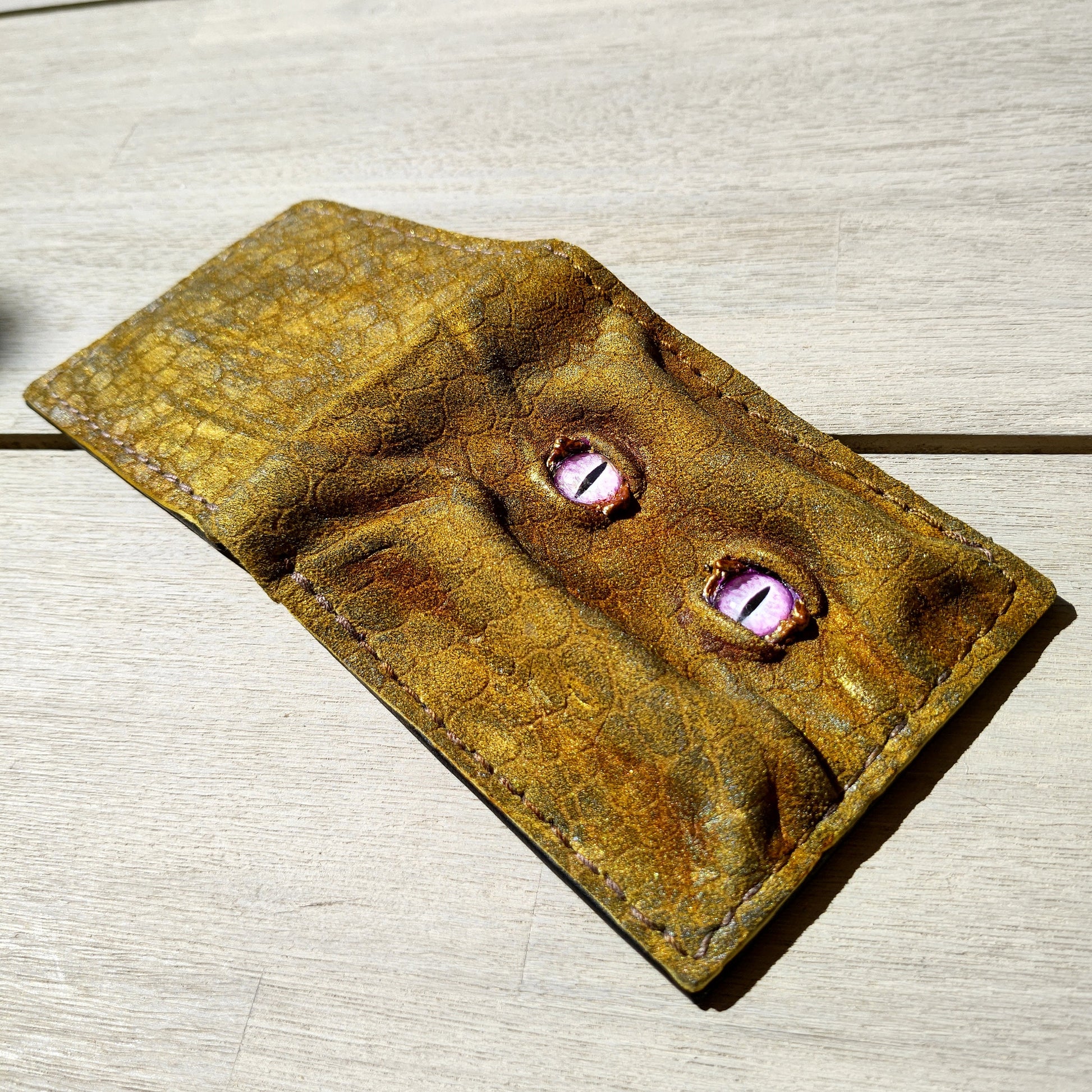 Enderman eyes - Golden Shmuggle face - Necromonicon - Pink demon eyes - Leather wallet.