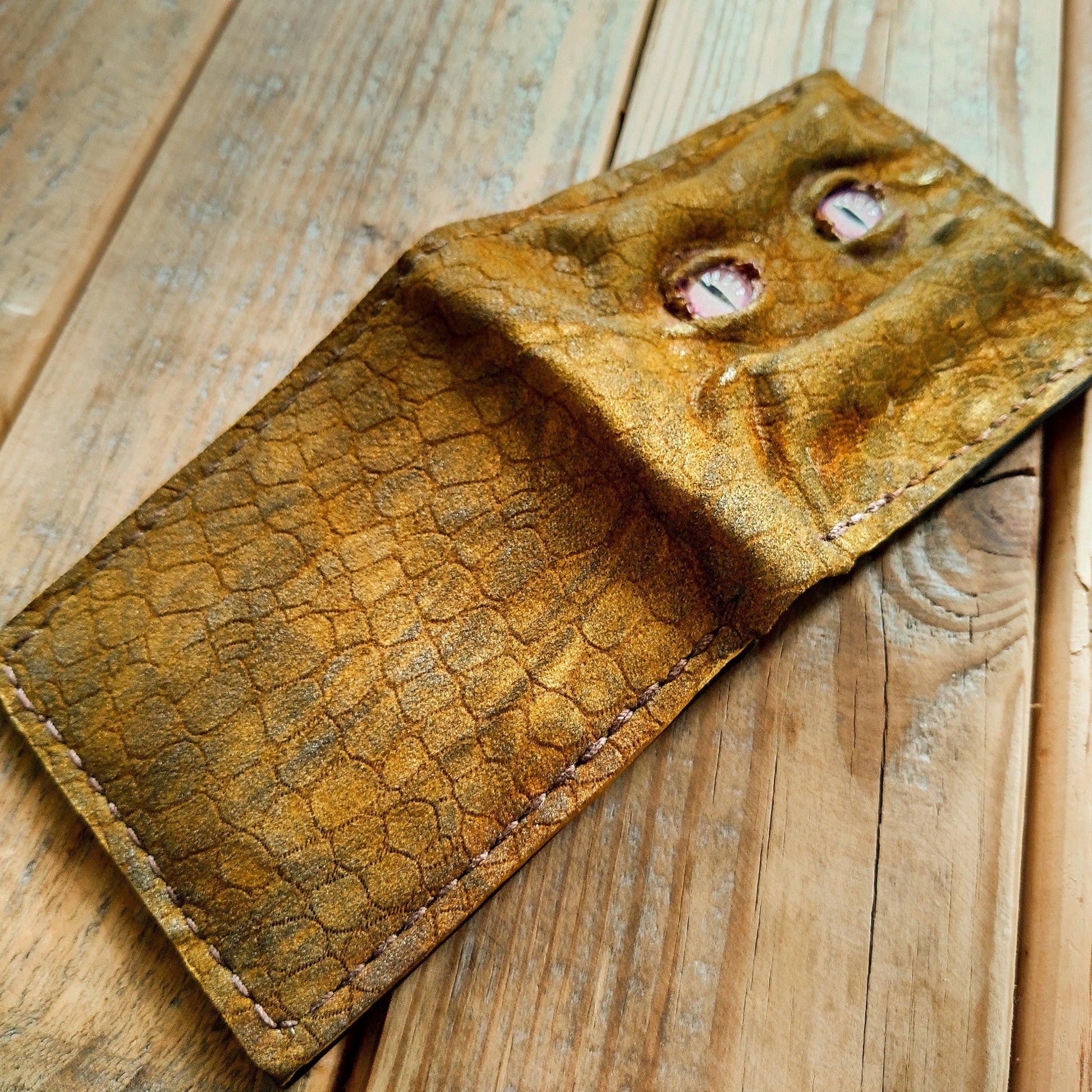 Enderman eyes - Golden Shmuggle face - Necromonicon - Pink demon eyes - Leather wallet.